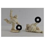 (2) MICHELIN MAN CAST IRON PAPERWEIGHTS