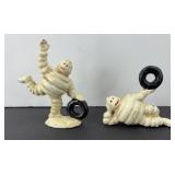 (2) MICHELIN MAN CAST IRON FIGURINES