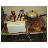 Table with Folding Leaves, Toaster, Wok, Knives