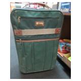 Green Luggage with Unique Fabric Pieces