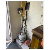 Items in Corner: Propane Tank, Weed Eater