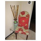 Vase with Decorative Sticks, Floral Chair, Pillow