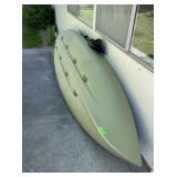 Green Kayak with Paddles