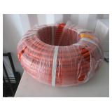 Roll Of Orange Plastic Tubing