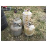3) Small Propane Tanks, 1) Large Propane Tank