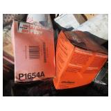 Burn Barrel with Oil Filters and Car Parts