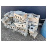 Cinder Blocks, Wood Pieces, Blue Garbage Barrel