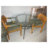 Glass Table with Design and Two Green Chairs