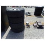 4) Tires and Ford Wheel Covers and Brown Inserts