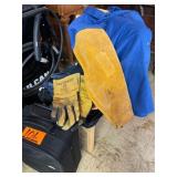 Welding gloves, shirt, small suitcase, orange vest