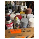 Box of assorted spray paint