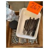 One metal drill bit and several punch tools