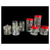 Seven Glass Storage Jars with Lids