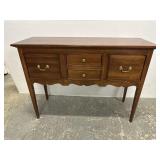 Cherry sideboard, has two doors on the side and a