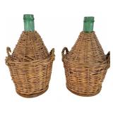 A Pair of Wicker Wrapped Green Glass Demijohns