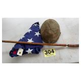 Helmet, walking stick and flag