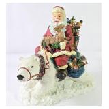 Santa Riding Polar Bear Sculpture
