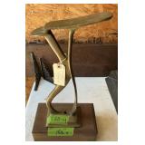BRASS SHOE REST ON WOOD BASE