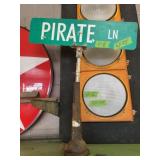 PIRATE LN STREET SIGN ON STAND
