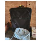 Black Suitcase and Blue Handbag