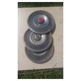 3 Chevrolet Hubcaps times the bid