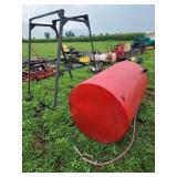 Red Fuel Tank with Metal Stand and Hose