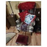 Upholstered Armchair With Red Throw and Footstool