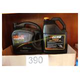 Two Partial 1 Gallon Bar & Chain Oil Jugs