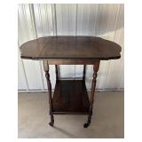 Antique small drop leaf table on coasters...