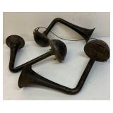 Three antique car horns