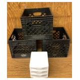 Three plastic milk crates and small storage