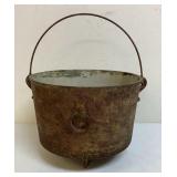Cracked cast-iron pot for garden art