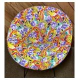 White wicker chair with metal base and floral