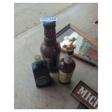 Assorted Beverage Bottles and Bar Signage Collection