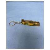 Mini Folding Pocket Knife Keychain with Green and Yellow Handle and Patterned Blade