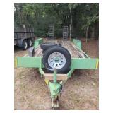 Green Dual Axle Utility Trailer with Wooden Deck and Ramps