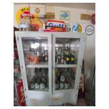 Service Station Display Cabinet with Oil Cans, Glass Bottles, and Soda Bottles