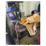 Welding Cart Setup with Oxygen Tank, Torches, and Safety Gear
