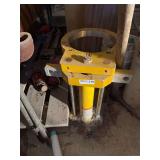 Industrial Yellow and Red Hydraulic Jacks and Associated Hardware