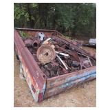 Truck Bed Loaded with Automotive Scrap Metal, Parts, and Spools of Wire on Utility Cart