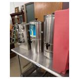 Contents On Prep Table:  Beverage Dispensers and Stainless Steel Pans Set