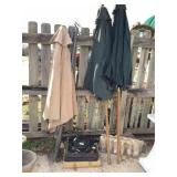 4 iron umbrella stands & 3 umbrellas