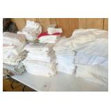 Table of linens/towels/sheets/coverlets