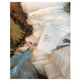 Table of linens/comforters/sheets