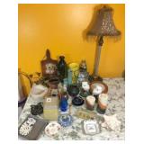 Lamp, candle & misc. household on table
