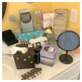 Washclothes & misc. household on bathroom counter