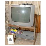 Phillips TV, rolling stand, VHS & DVD player,