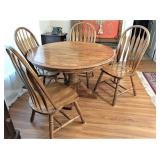 solid oak pedestal table w leaf & 4 heavy chairs