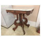 marble top table 28 x 20 x 29H  w  metal casters