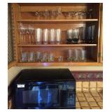 All in upper cabinet and on counter: microwave,